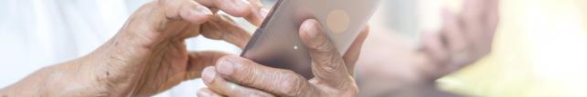 Elderly person using mobile phone