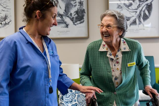 Carer having a joyful exchange with resident