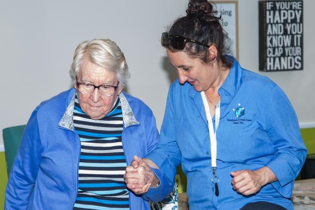 Carer having a joyful exchange with resident