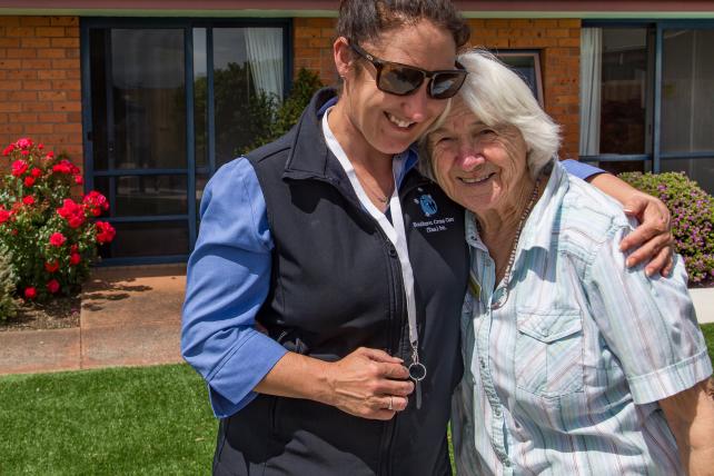 Carer having a joyful exchange with resident