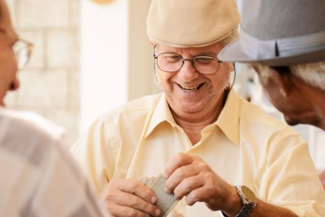Elderly men playing cards