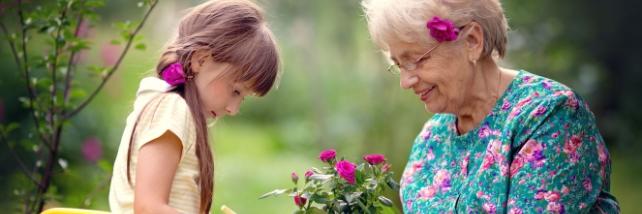 Child with elderly woman in the garden