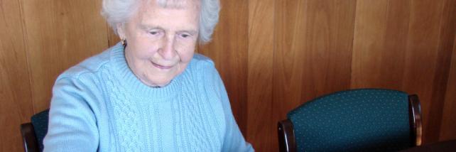 Lady matching objects to pictures